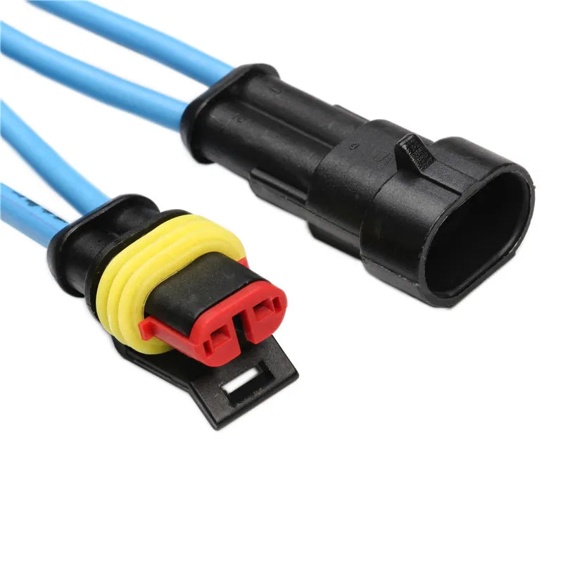 A waterproof automotive electrical connector kit showing a black male and yellow female terminal with blue wires.