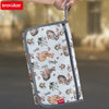 A foldable baby changing mat with a waterproof cover and storage bag featuring a pattern of small squirrels on a white backgr