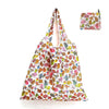 A reusable shopping tote bag featuring a colorful pattern of various fruits and vegetables.