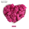 A pile of pink silicone crown star heart beads for DIY jewelry making