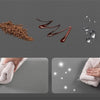 A brown powder and liquid are shown next to a hand towel and a white towel.