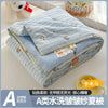 A blue and white striped quilt with a playful cartoon print, folded and displayed on a light surface.
