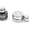 A silver metal desk spinner with a smooth ball top and base, used for stress relief.