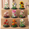A collection of miniature floral arrangements made from building blocks, featuring roses and other flowers in various colors.