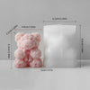 A pink silicone mold shaped like a bear, used for making candles, soap, and resin crafts.