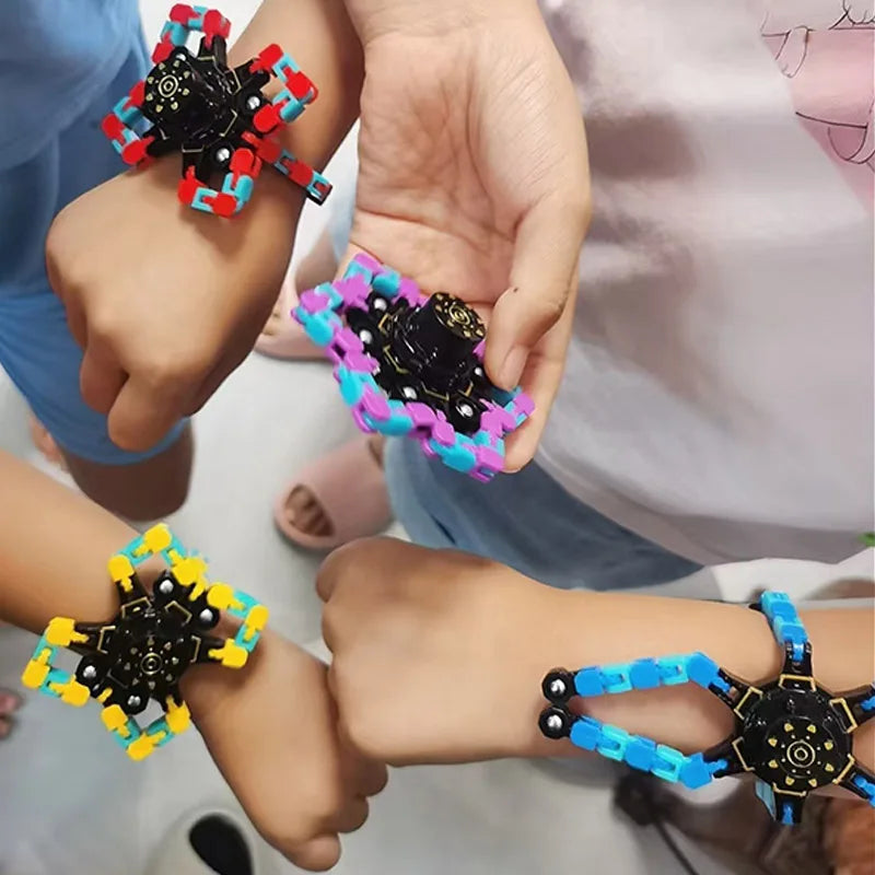 A hand holds a colorful transformable fidget spinner set with black and neon colored parts.