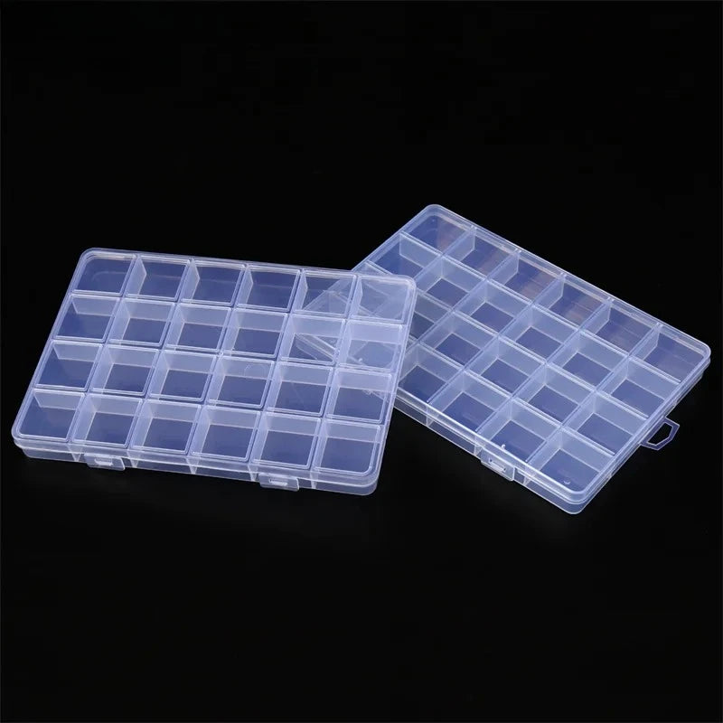 A clear plastic storage box with multiple compartments and fixed dividers is shown against a black background.