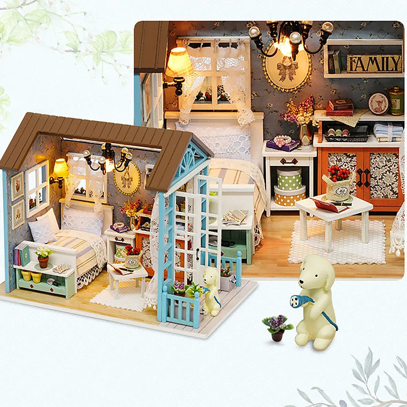A detailed wooden miniature dollhouse kit featuring a bedroom and living area with decorative elements and lighting.