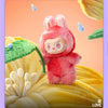 A pink Labubu Big Into Energy plush doll with large ears is featured against a yellow textured background.