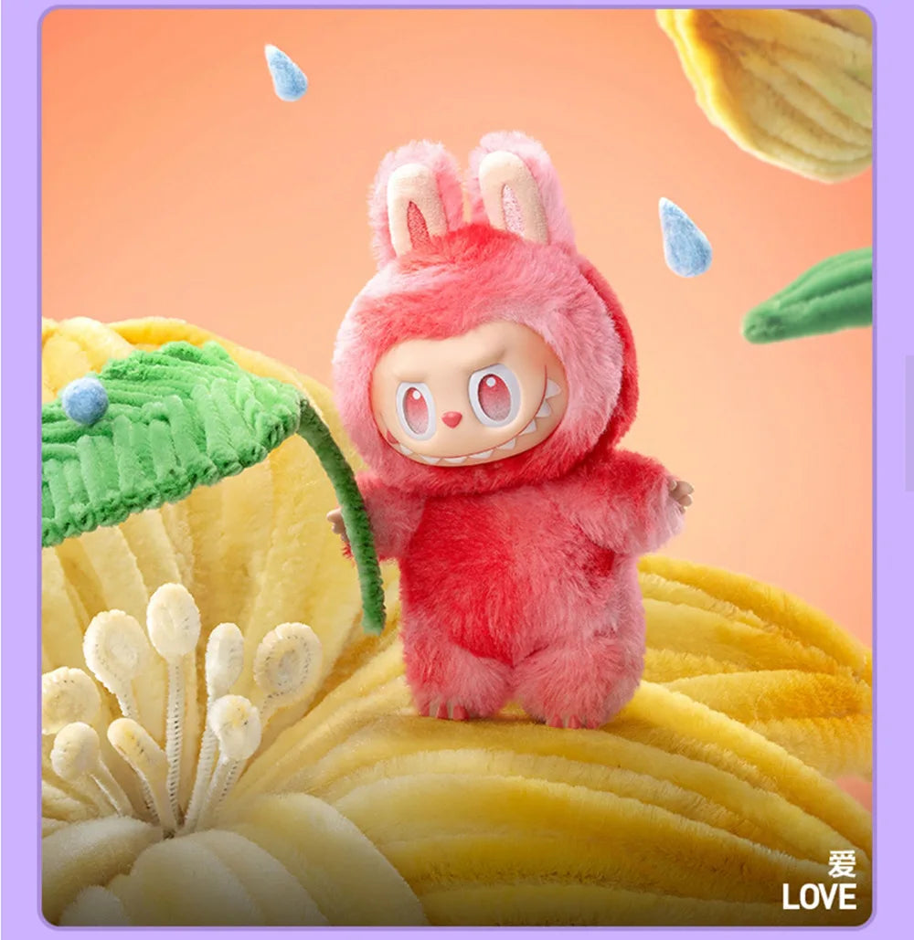 A pink Labubu Big Into Energy plush doll with large ears is featured against a yellow textured background.