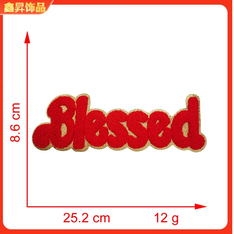 Red embroidered chenille iron-on patch spelling the word Blessed