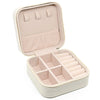 A light pink PU leather jewelry storage box with a hinged lid and divided compartments.