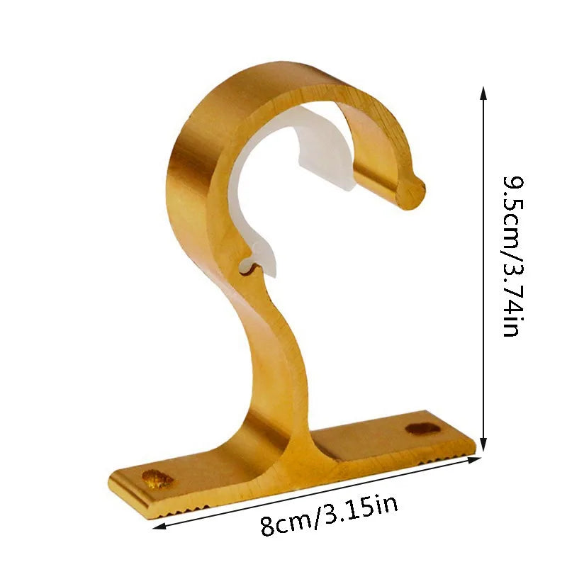 A brass curtain rod bracket featuring a curved hook and a flat base, used for securing window treatments.