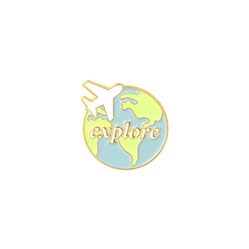 A vintage airline ticket enamel brooch set featuring a silhouette of an airplane and a map of the Earth.