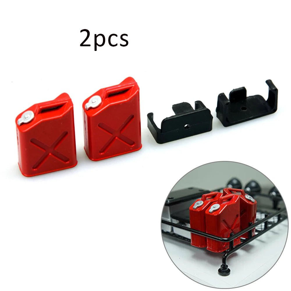 Two red plastic RC crawler decorations, including a shovel and fire extinguisher, shown next to a black mounting piece.
