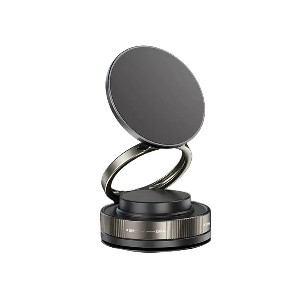 A round, matte black magnetic car phone mount with a smooth, circular top.