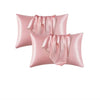 Dos fundas de almohada de satén de seda rosa con tela fruncida