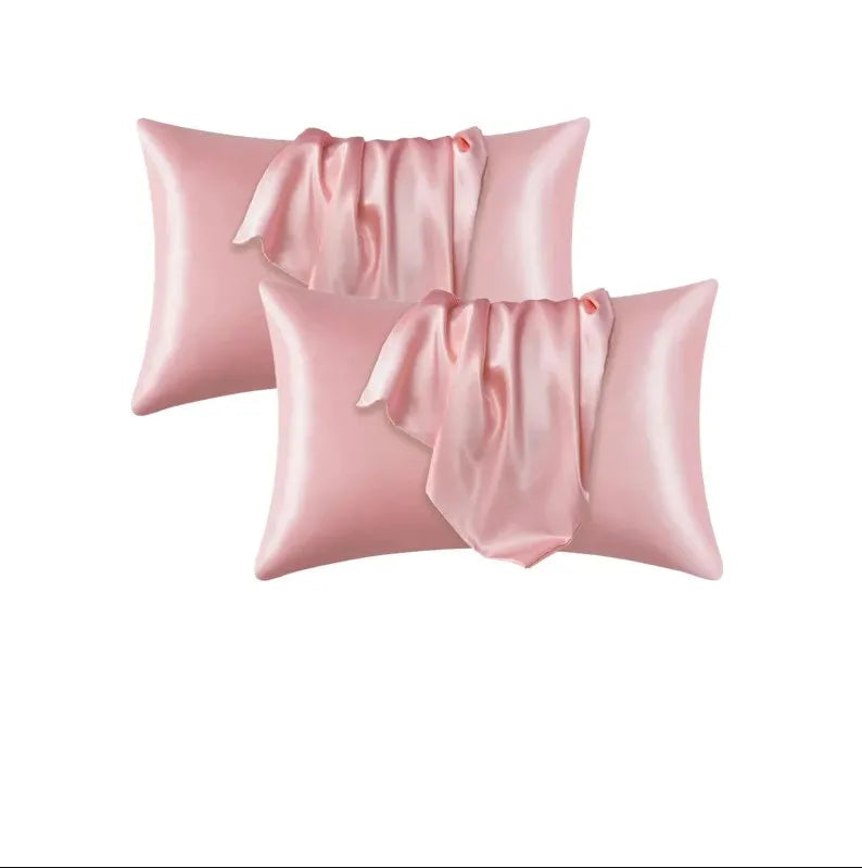Dos fundas de almohada de satén de seda rosa con tela fruncida