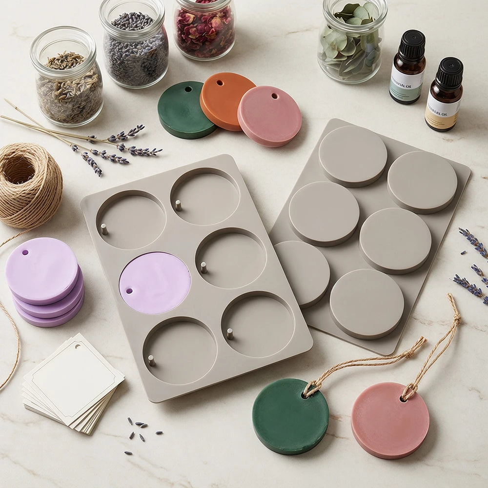 A collection of silicone molds and wooden beads for crafting soap and aromatherapy discs.