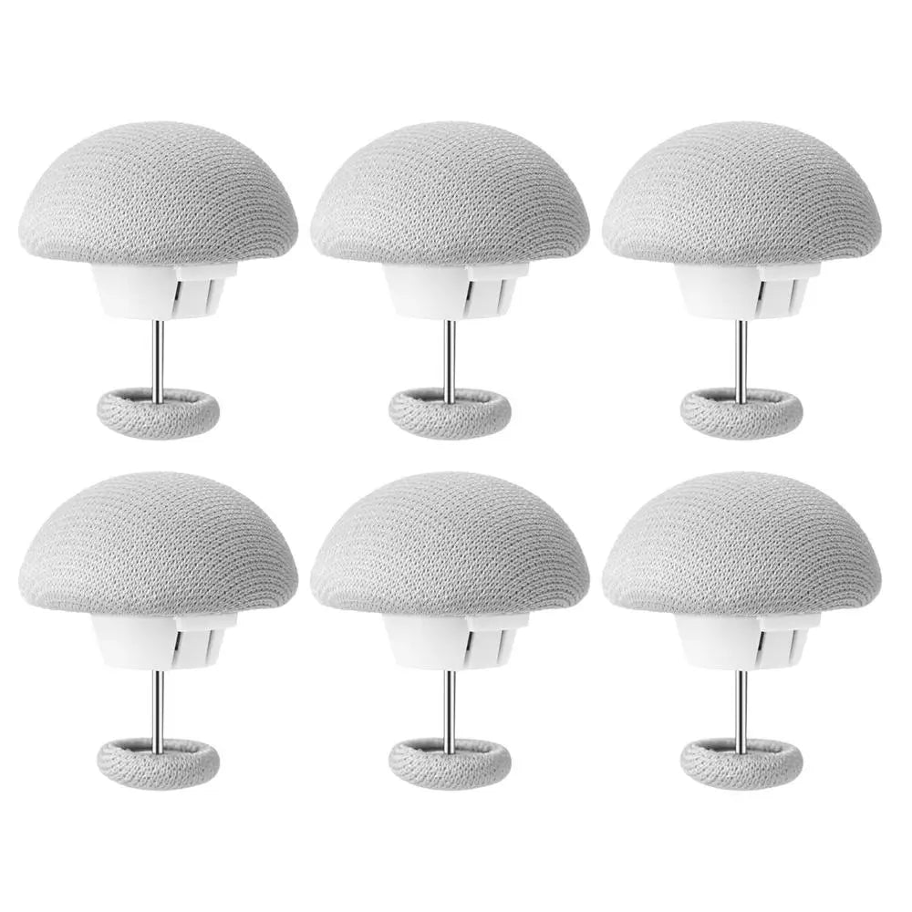 A set of six gray non-slip duvet cover clips with white bases and metal stands.