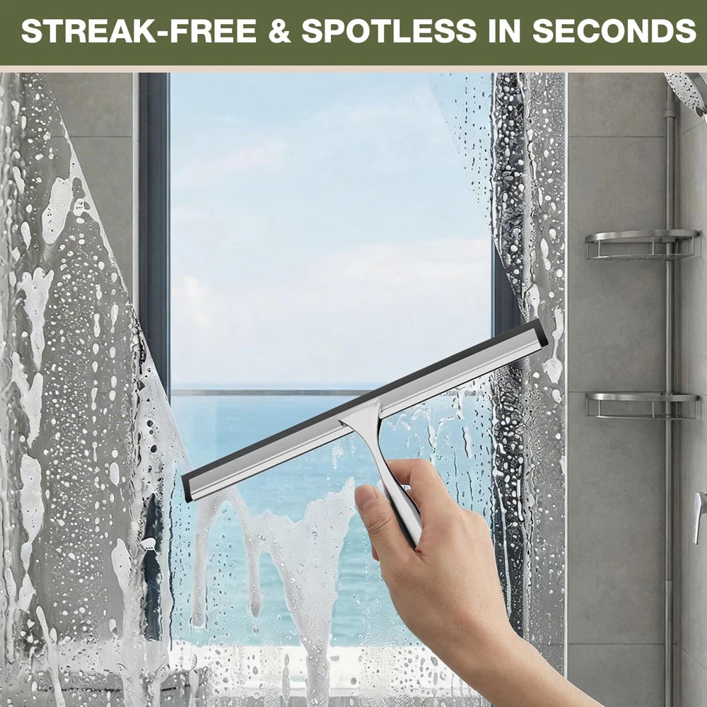 A hand uses a soft silicone shower squeegee to remove water streaks from a window pane.