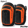 A pair of black and orange style-2 knee pads shown for sale.