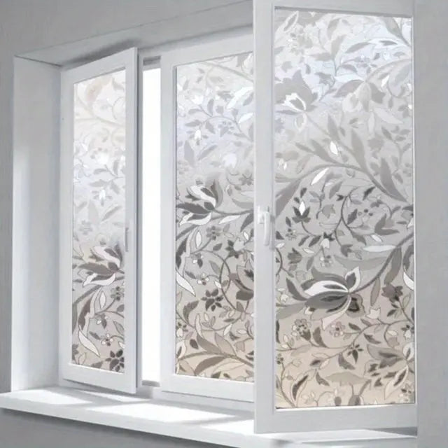 A window featuring elegant tulip privacy film with a self-adhesive design.