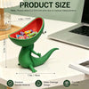 A green lizard-shaped soap holder with an open mouth design is shown on a white table.