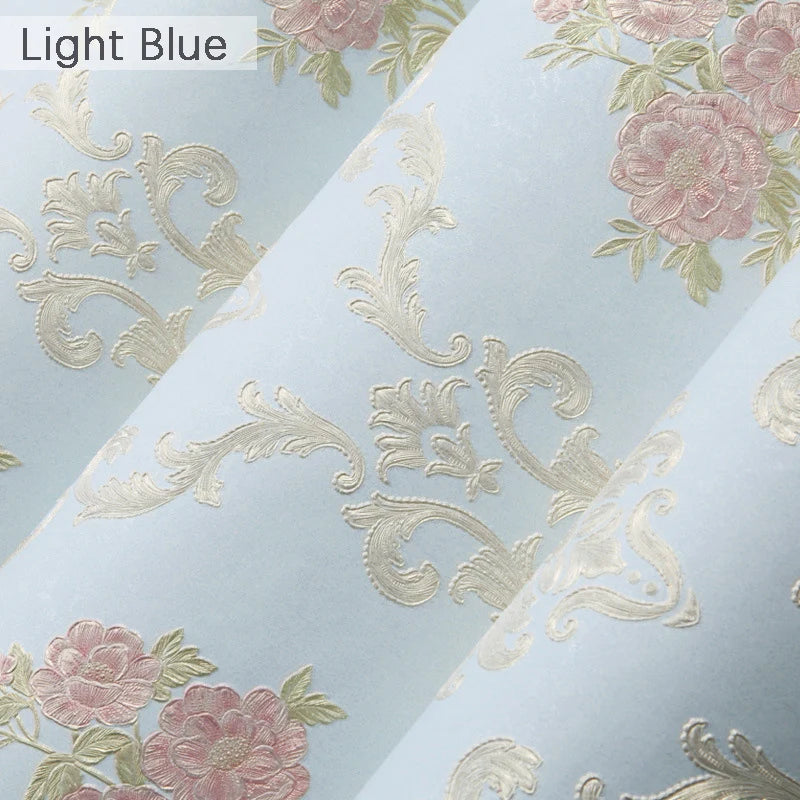 Light blue floral wallpaper featuring pink and gold damask patterns