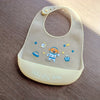 A light beige silicone baby bib featuring a cute cartoon animal print and the text Hello My Baby.