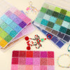 A collection of multicolor acrylic rice beads in various shades and colors stored in a grid box.