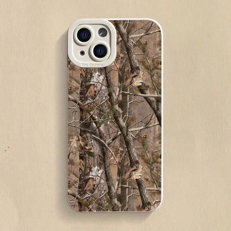 A silicone phone case with a camera lens cutout featuring a forest camouflage pattern.
