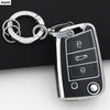 A silver key fob attached to a black car key cover for VW, SEAT & Skoda models.
