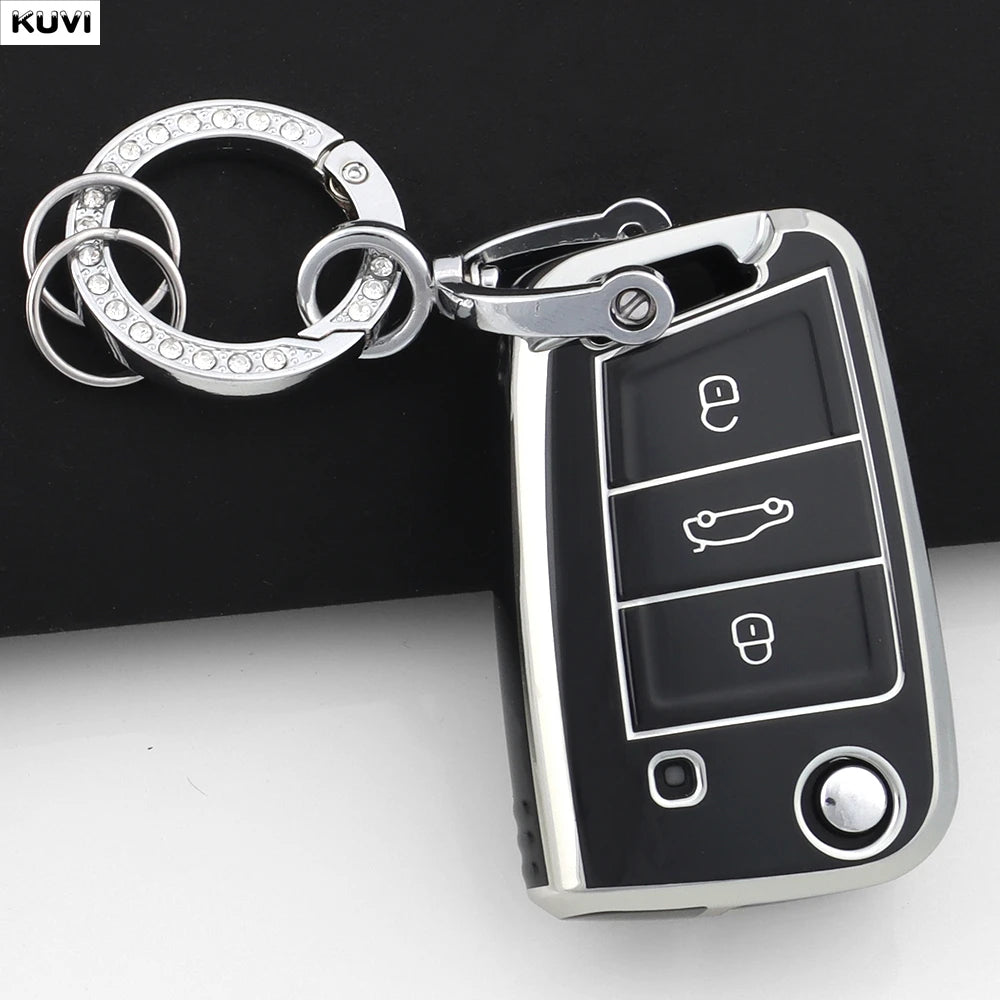 A silver key fob attached to a black car key cover for VW, SEAT & Skoda models.