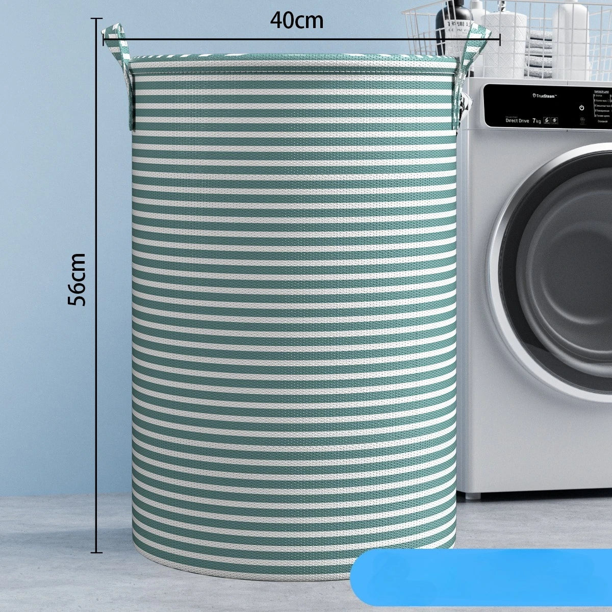 A tall, cylindrical foldable laundry basket with green and white stripes is shown next to a washing machine.