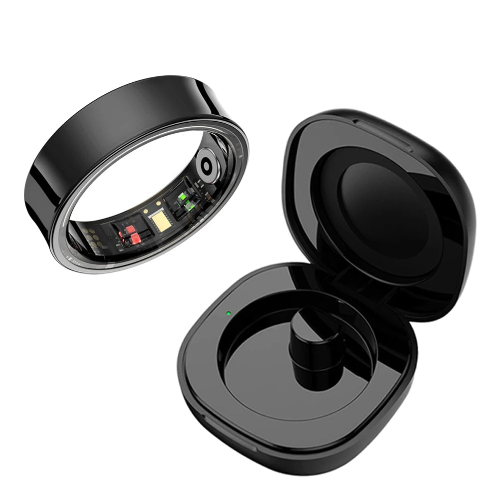 A black smart ring with a hinged lid is shown, displaying internal components and the exterior design.