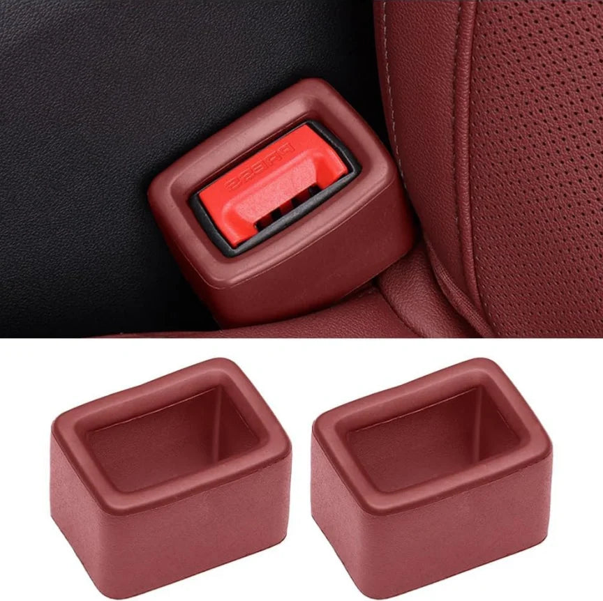 Two protective covers for car seatbelt buckles in a reddish-brown color.