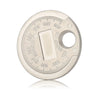 A circular metal gauge with markings for measuring spark plug gap, showing a gap between 0.6 and 2.4 mm.