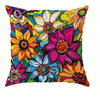 A decorative pillowcase featuring a vibrant floral print with yellow, pink, purple, and blue flowers.