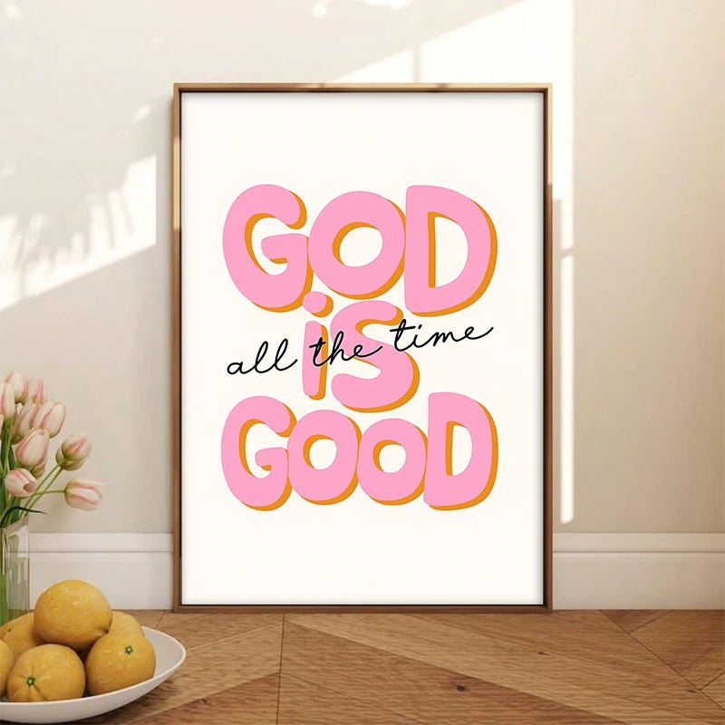 A framed canvas print featuring the text GOD is GOOD all the time in bright pink and orange lettering.
