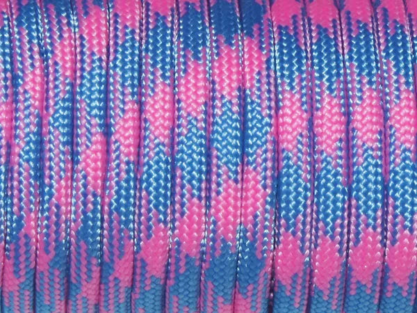 Close-up of pink and blue 7-strand paracord rope coiled for camping and climbing.