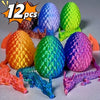 A set of twelve colorful 3D printed dragon and egg sculptures displayed on a light surface.
