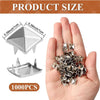 A hand holds a pile of silver metal pyramid studs with four prongs for DIY fashion projects.