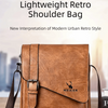 A brown vintage leather shoulder bag with a flap and adjustable strap is displayed on a wooden surface.