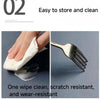 A hand wipes a silver fork with a white wipe, demonstrating the product's scratch-resistant and wear-resistant features.