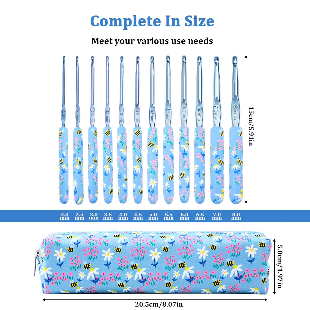 A set of ergonomic crochet hooks in various sizes from 2.0 to 10.0 mm with a blue bee design, packaged in a blue case.