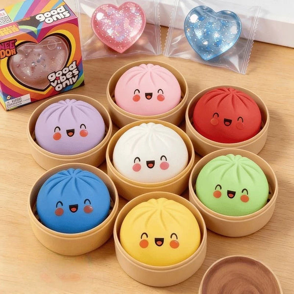 A collection of pink, blue, red, white, and yellow simulation baozi squeeze stress relief toys in various colors and packagin