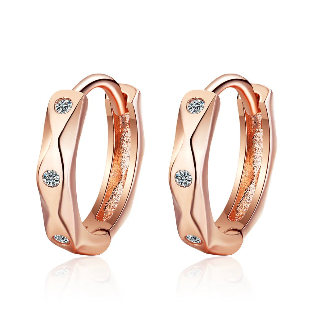 Pair of rose gold sterling silver turquoise hoop earrings with textured finish
