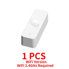 A white smart motion sensor device with a round lens and a small cutout on the bottom.
