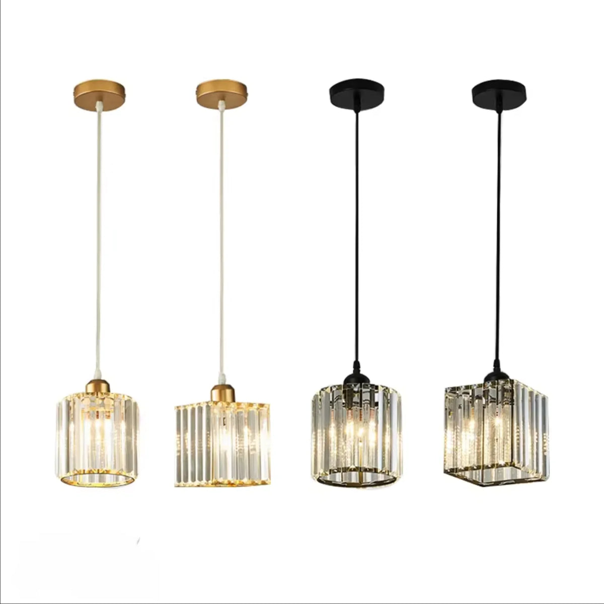 A set of three crystal pendant lights with brass and black finishes.